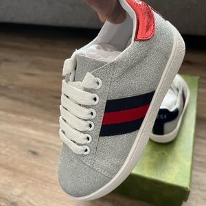 Kids Gucci Sneaker never wore, too small now to fit…